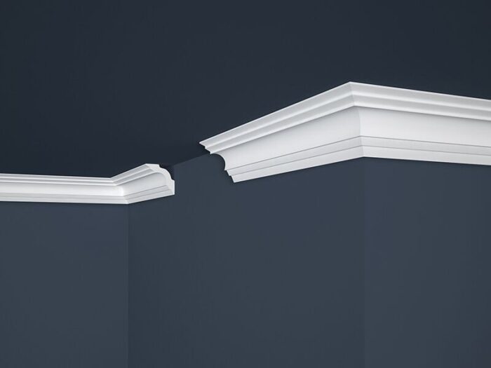 La moldura Cornisa E14 50x50mm. x 2mts.  Marbet Design Esta moldura aporta elegancia y sofisticación a cualquier espacio interior. Con líneas suaves y curvas delicadas, esta moldura cornisa refleja una estética clásica y atemporal, evocando tradición y refinamiento. Fabricada con poliestireno extruido de alta densidad, esta moldura ofrece durabilidad y resistencia, creando ambientes acogedores con un acabado impecable.